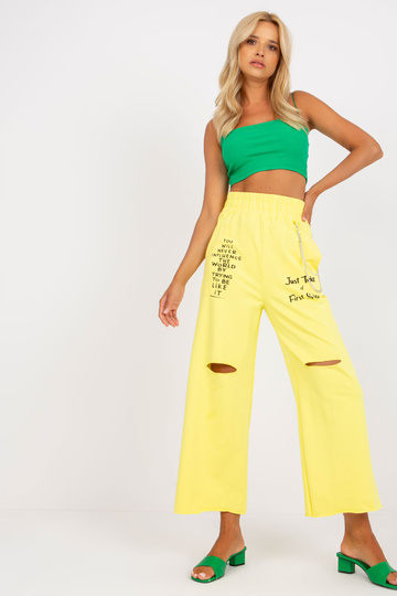 Žluté dámské tepláky se...