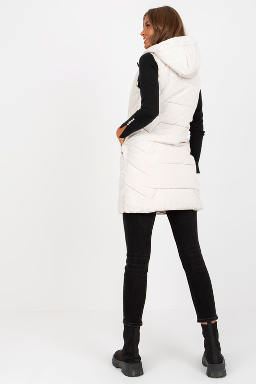 Světle béžová dlouhá péřová vesta s... Světle béžová dlouhá péřová vesta s...