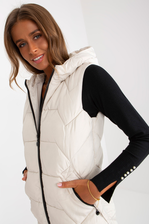 Světle béžová dlouhá péřová vesta s... Světle béžová dlouhá péřová vesta s...