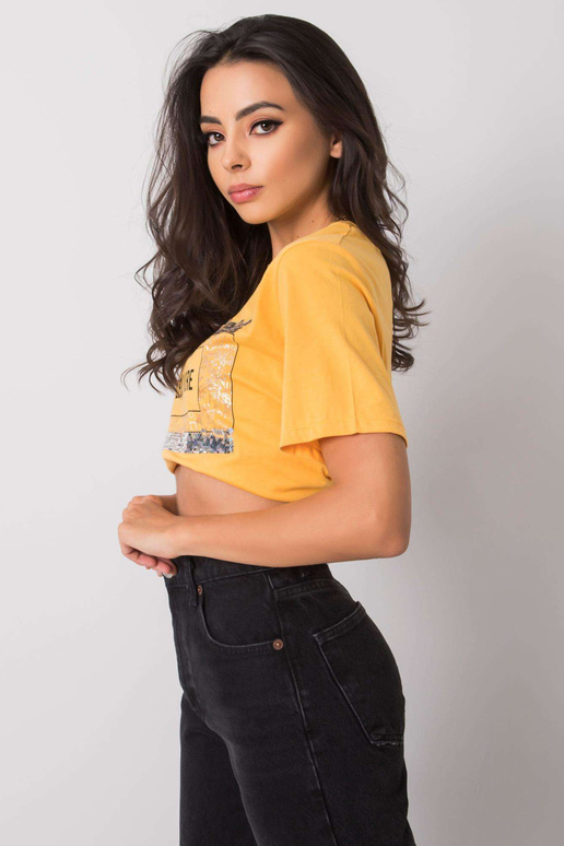 Světle oranžové tričko s nápisem Nikki Světle oranžové tričko s nápisem Nikki