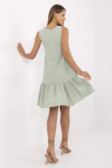 Světle zelené volánové šaty...