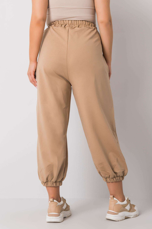 Béžové tepláky velké velikosti s...