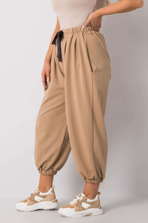 Béžové tepláky velké velikosti s...