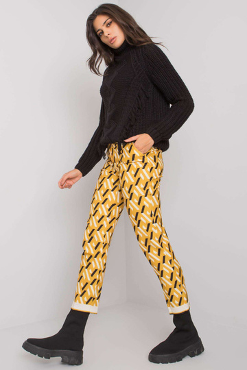 Černožluté kalhoty se...