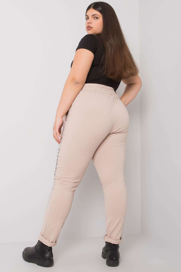 Béžové tepláky plus size s...