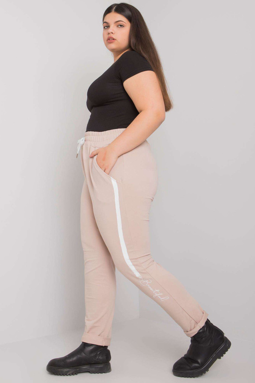 Béžové tepláky plus size s potiskem...