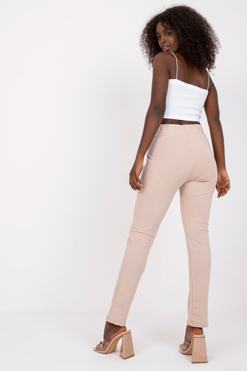 Béžové tepláky se...