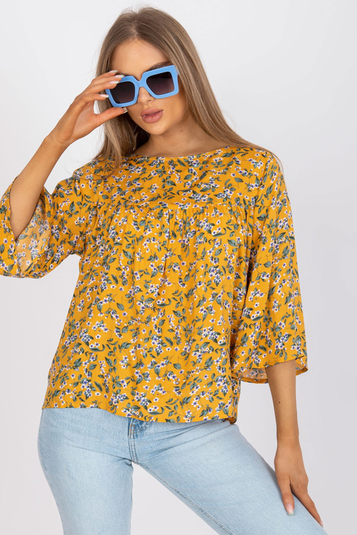 Žlutá halenka s květinovým potiskem...