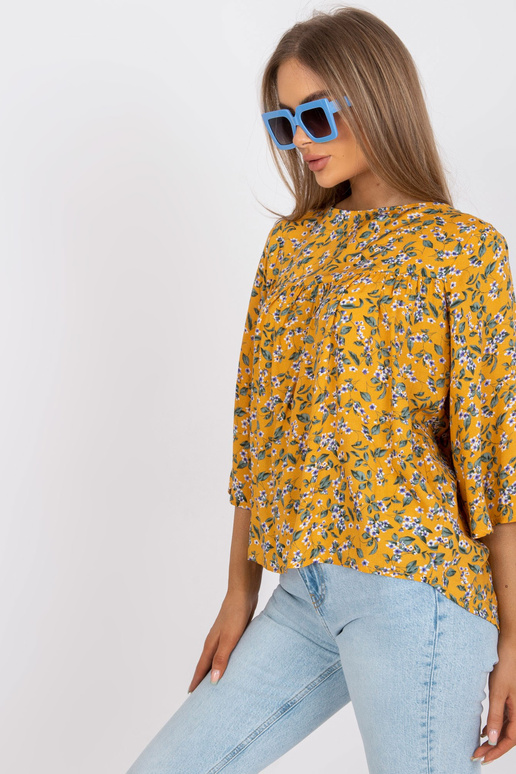 Žlutá halenka s květinovým potiskem...