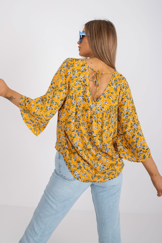 Žlutá halenka s květinovým potiskem...