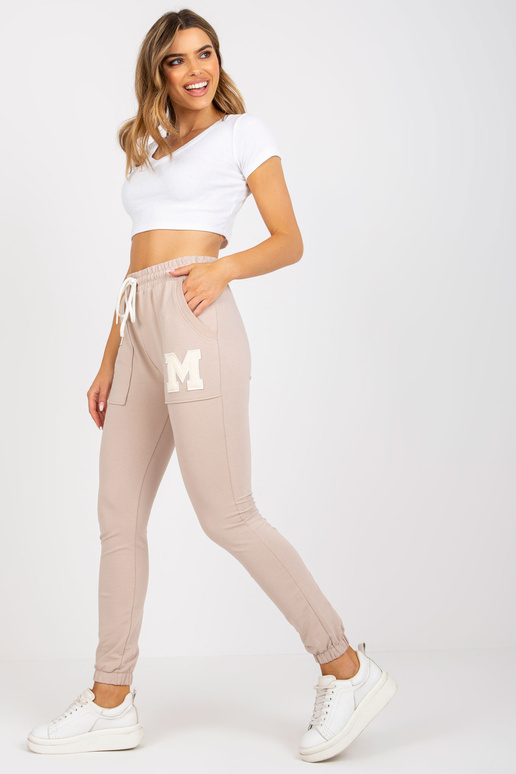 Béžové bavlněné tepláky s kapsami