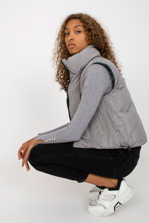 Tmavě zelená krátká péřová vesta s...