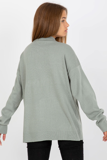 Jasnozielony sweter...