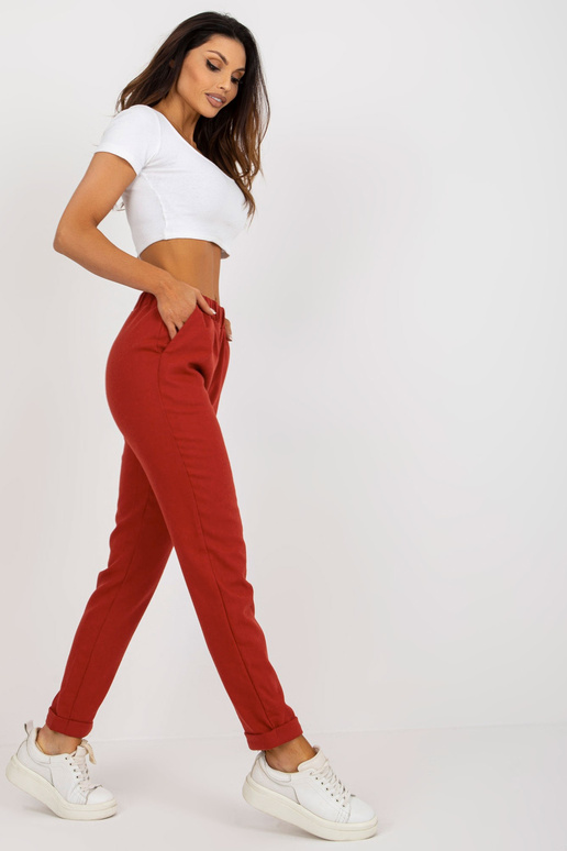 Tmavě oranžové látkové kalhoty s kapsami