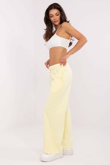 Světle žluté sportovní kalhoty